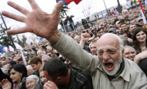 A demonstrator shouts slogans during a protest rally in Tbilisi April 9, 2009. At least 60,000 Georgians rallied on Thursday at the start of a campaign to try to force President Mikheil Saakashvili to resign, an effort led by opponents emboldened by last year's disastrous war with Russia. REUTERS/David Mdzinarishvili (GEORGIA POLITICS CONFLICT IMAGE OF THE DAY TOP PICTURE)